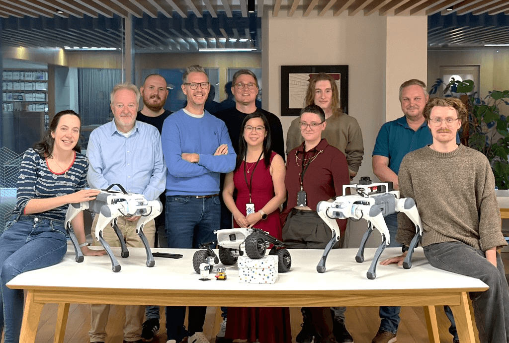 OLO Robotics team with robots in the office
